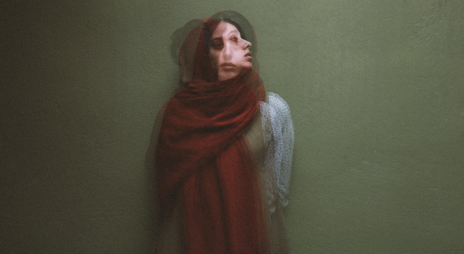 two cast iron pots over a flame