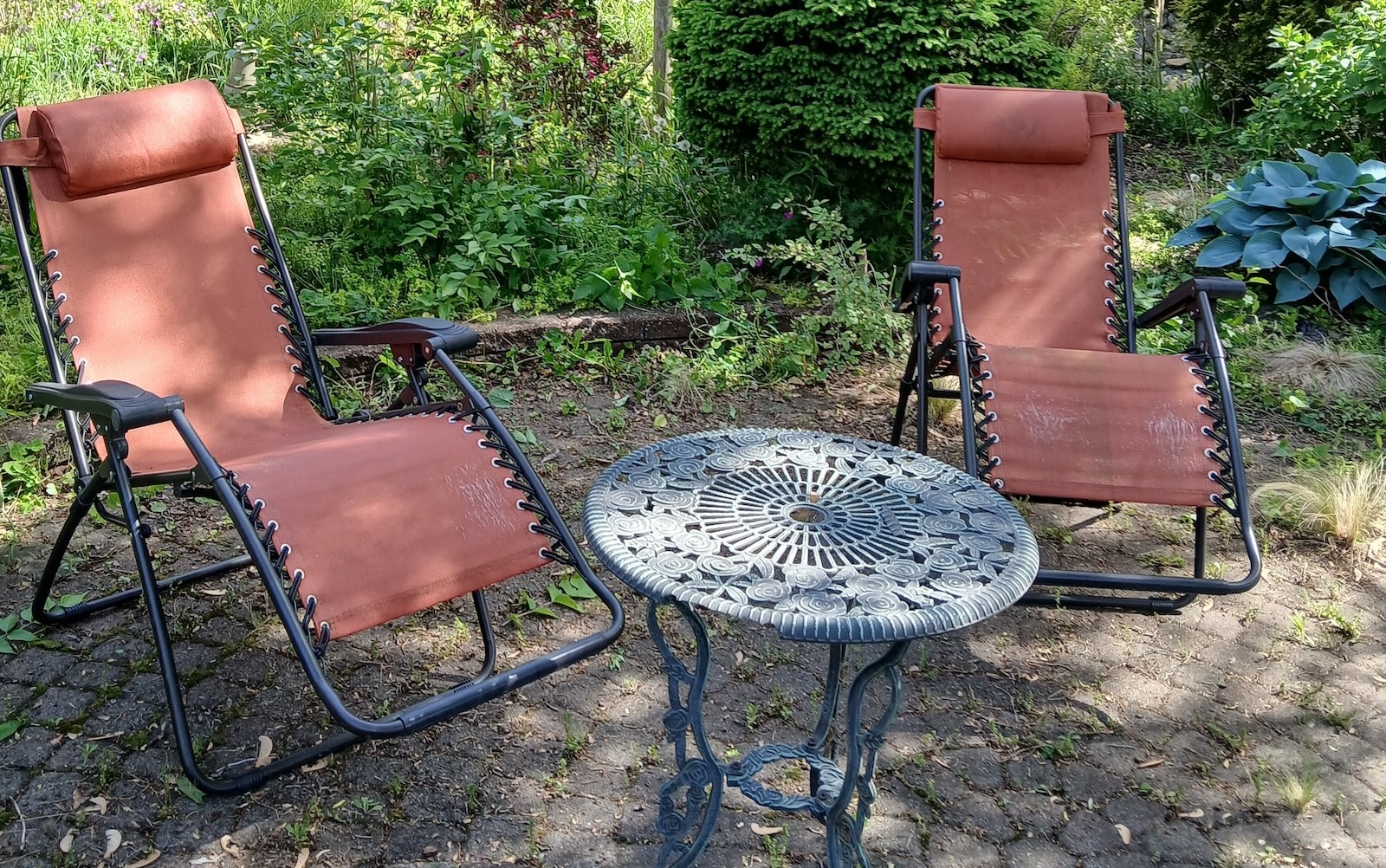 Vacated Lawn Chairs two cast iron pots over a flame