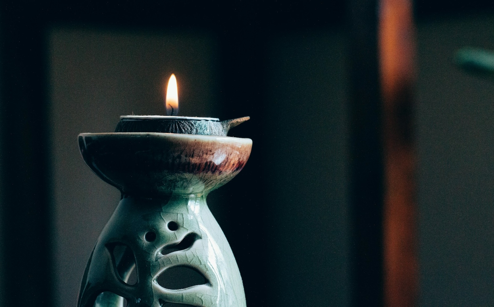 two cast iron pots over a flame